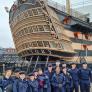 Lower Fifth pupils in the Navy standing in front of the HMS Victory on a CCF trip to Portsmouth thumbnail