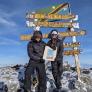 Ettiene at the top of Mount Kilimanjaro with a Brighton College tote bag raising money for charity thumbnail