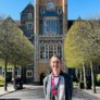 Olivia Haverson standing in the Quad with her Brighton Marathon medal thumbnail