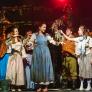 Pupils in costume as Cinderella on stage performing in the production of Into the Woods thumbnail