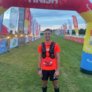 Jeremy Connor standing at the finish line after running the 100km ultramarathon from London to Brighton thumbnail