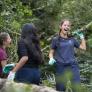 Pupil in the woods cutting, clearing and carrying branches in gloves on Make A Difference Day thumbnail