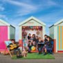 Prep School pupils playing together in a beach hut on Brighton seafront on a sunny day thumbnail