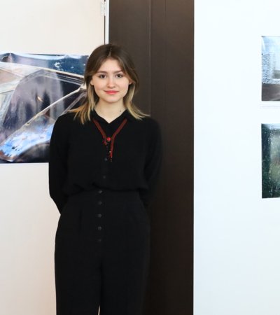 Sixth Form pupil showing charity photo exhibition organised to raise money for Ukraine