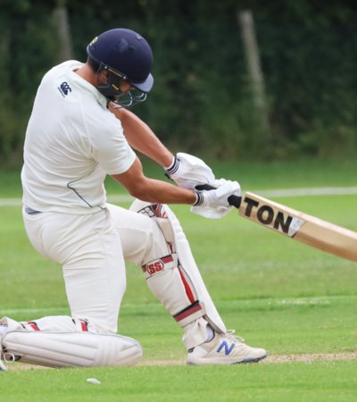 Pupil bending down to hit a shot in the BOWS competition