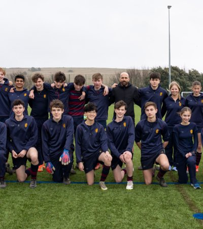 Footballers standing with Bruno Saltor Grau Chelsea Coach and Ex International after a session