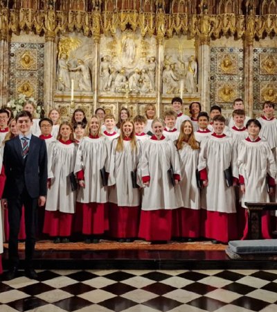 Chamber Choir standing in front of the altar performing Evensong at St George's Chapel