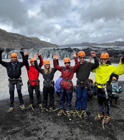 Pupils in climbing harnesses and helmets enjoying exploring glaciers on their Geography Trip to Iceland