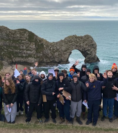 Pupils on a Geography Trip to the Jurassic Coast in front of Durdle Door