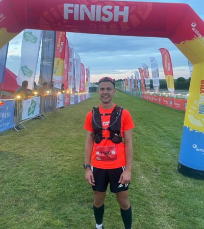 Jeremy Connor standing at the finish line after running the 100km ultramarathon from London to Brighton