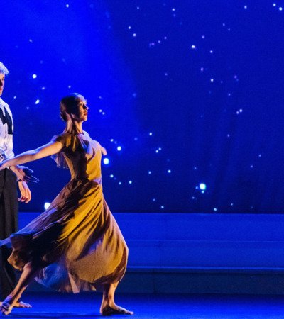 Dance pupils perform a duet on stage in the Dance Show