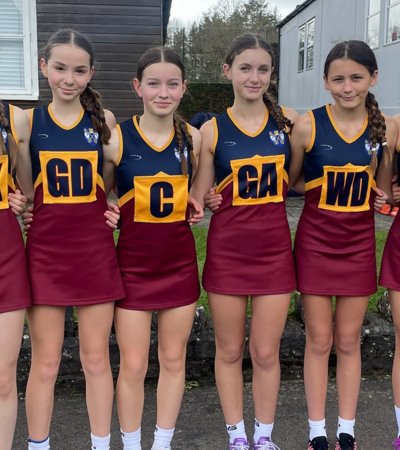 Prep School U13A Netball Team with their bibs and dresses on