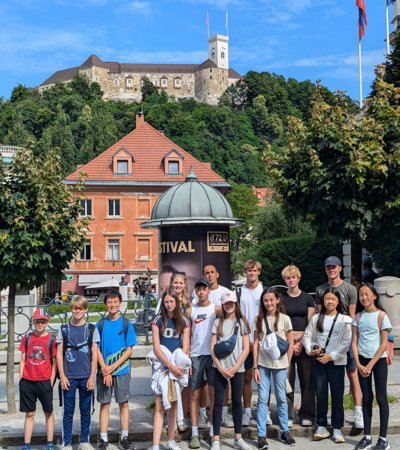 Swimmers standing in Congress Square in Ljubljana on their Swimming Tour