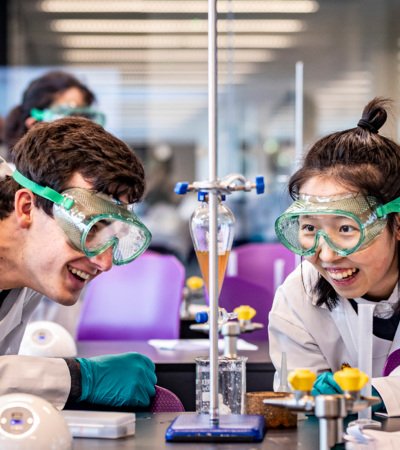 Pupils in a Chemistry lesson enjoying a titration experiment