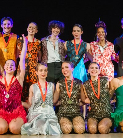 Pupils with their medals and the judges in the Strictly Come Dancing Finals