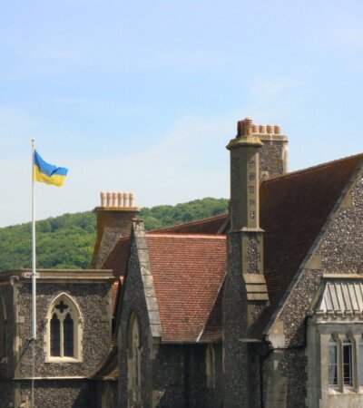 Ukraine flag flying up the flagpole in the Quad on a sunny day