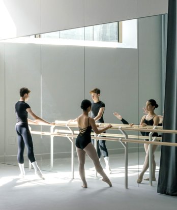 Dance scholars practicing at the barre in the Dance Studio