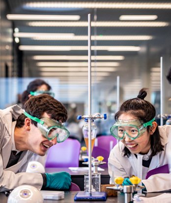 Pupils in a Chemistry lesson enjoying a titration experiment