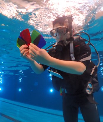 Pupil conducting a Physics experiment with colour with scuba equipment