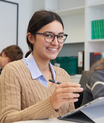 Pupil answering questions on their computer in an A-Level lesson