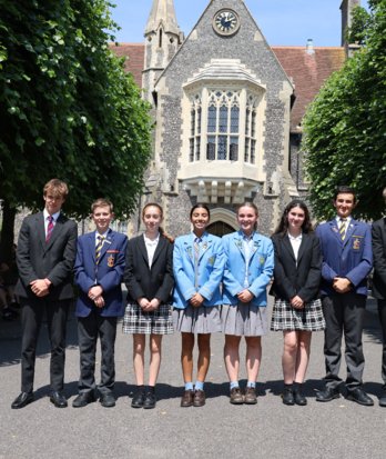 4th Form pupils with Australian exchange students standing together in the Quad