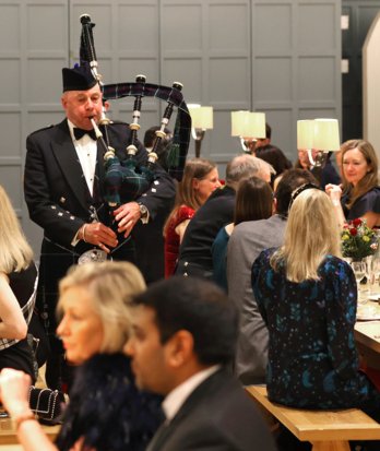 Bagpiper entertaining guests at the annual Burns Night celebration