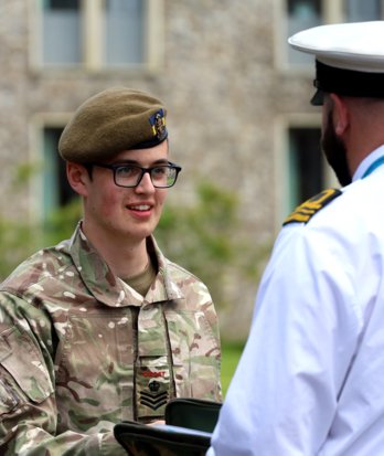 CCF cadet in Army uniform enjoying Service