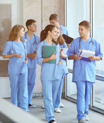 Pupils walking in their scrubs enjoying Medics club