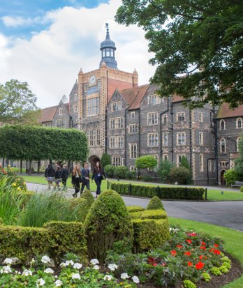 Pupils walking through the Quad on a sunny day