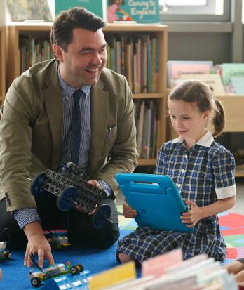 Pre-Prep pupils and a teacher enjoying learning coding with electronics in the classroom