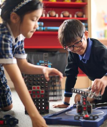 Pre-Prep pupils building structures with blocks in Young Engineers Club