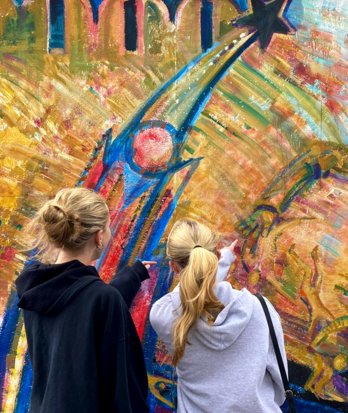 Pupils admiring an artwork together on a trip to Berlin