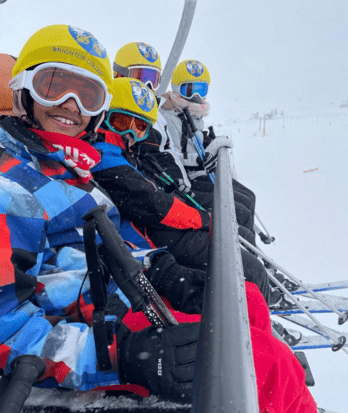 Prep School pupils on a chair lift with the skis on a trip to the French Alps