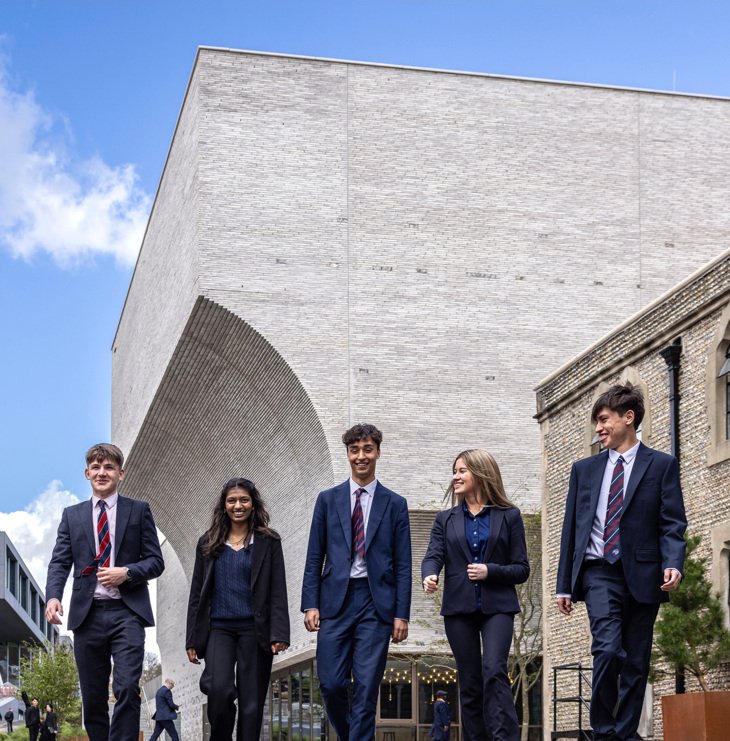  Pupils enjoying themselves whilst walking outside the Richard Cairns building 