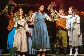  Pupils performing on stage in the Upper School Production of Into the Woods 