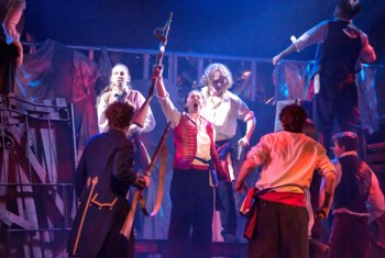  Pupils on stage performing the barricade scene in their production of Les Misérables 