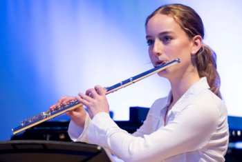  Sixth Form musician playing the flute in a concert 