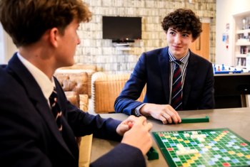  Boarders having fun playing Scrabble together in the Abraham Common Room 