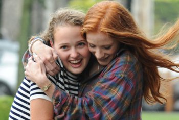  Pupils hugging celebrating their grades GCSE Results Day in the Quad 