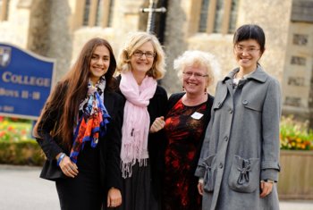  Old Brightonians on a tour of the school standing in the Quad 