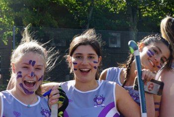  Fenwick House pupils with face paint and house vests enjoying House Hockey 