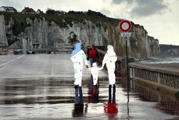  Pupil's photography piece of people walking along the seafront with the people replaced by maps in their form 