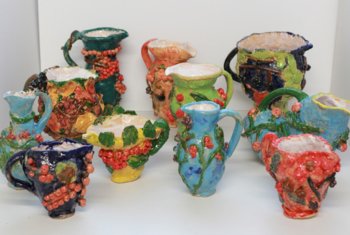  A variety of different coloured and patterned jugs made by Prep School pupils 