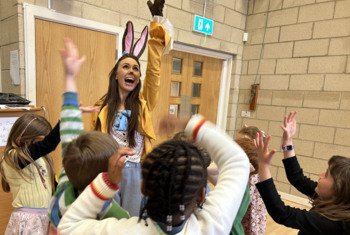  Pupils excitedly crowded round the Easter Bunny at Rockhoppers Holiday Club 