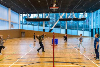  Pupils at Rockhoppers Holiday Club in the NASH playing a game of Badminton 