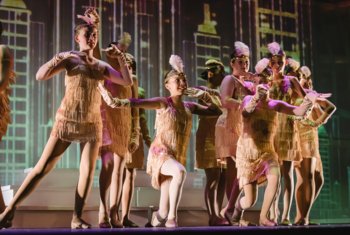  Pupils in 1920s inspired costumes performing on stage at the annual Dance Show 