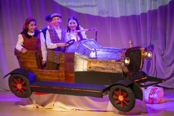  Prep School pupils performing a scene in the car in a production of Chitty Chitty Bang Bang 