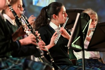  Prep School pupils playing the clarinet and flutes in a concert in the Hall 