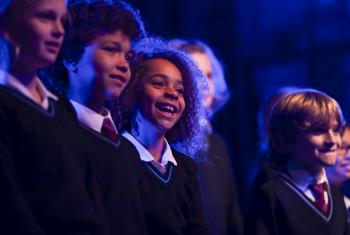  Prep-School pupils under the spotlight performing a concert on the stage 