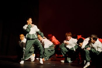  Boys Dance Troupe on the stage performing a routine at the annual Dance Show 